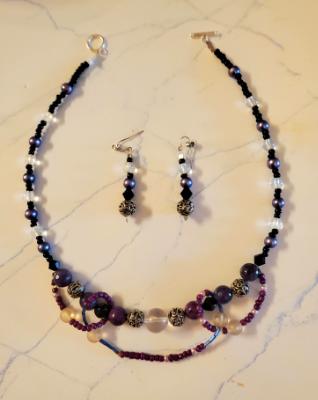 Purple and Black materials with Amethyst accent. Clear and Frosted glass with Silver Filigree Beads