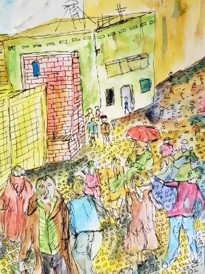 The movement of peoples along cobblestone street never relents. Lisbon, Portugal. The movement of peoples along cobblestone street never relents. Lisbon, Portugal.