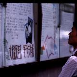 Chinese man Viewing the news