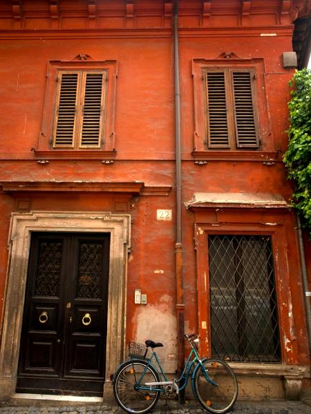 Red wall, blue bicycle