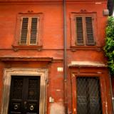 Red wall, blue bicycle
