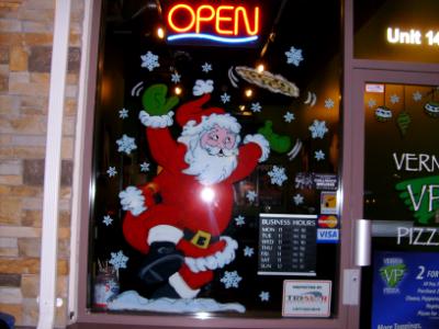 Santa throwing pizza in the air Santa throwing pizza in the air