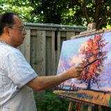 Jimmy Sun is working on his painting