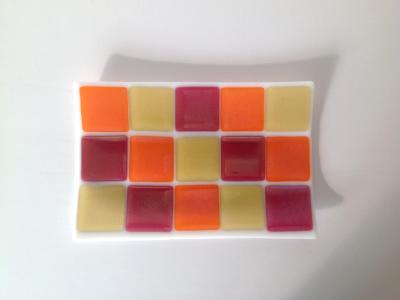 White platter with irid yellow, orange, pink blocks
