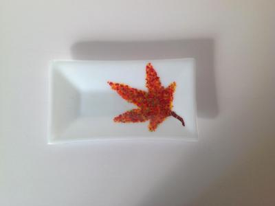 White plate with autumn leaf White plate with autumn leaf
