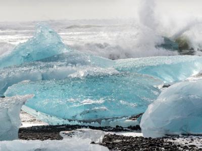 Waves Crash on Blue Icebergs Waves Crash on Blue Icebergs