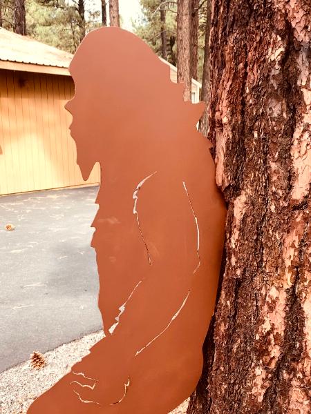 Bigfoot Leaning on Tree