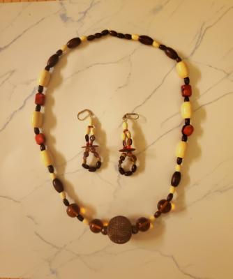 Light and dark Wooden and Glass beads with Red (unknown) stone and mesh wire ornament 