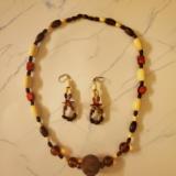 Light and dark Wooden and Glass beads with Red (unknown) stone and mesh wire ornament 