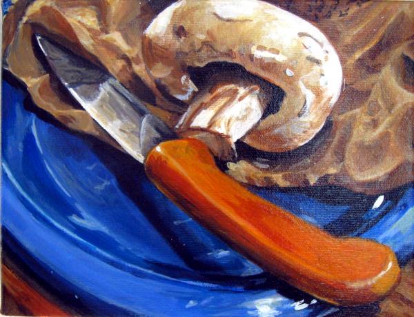 Mushroom and knife on plate