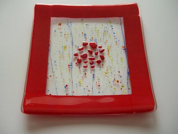 Red rimmed garlic and oil plate