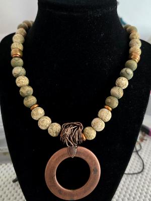 Copper pendant with varigated wooded beads Copper pendant with varigated wooded beads
