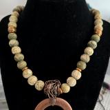 Copper pendant with varigated wooded beads