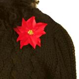 Poinsettia Pin on Black Sweater